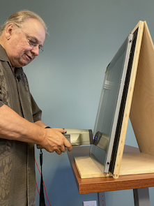 Randi Ernst, FDR Design Inc., shows how to use a Sparklite machine to test gas fill.