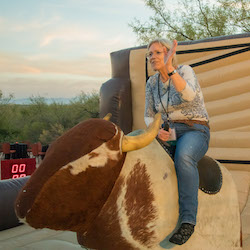 Marg Webb on bucking bronco, photo by Jeff Baker